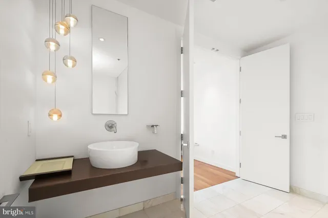 a bedroom with a bed and a desk