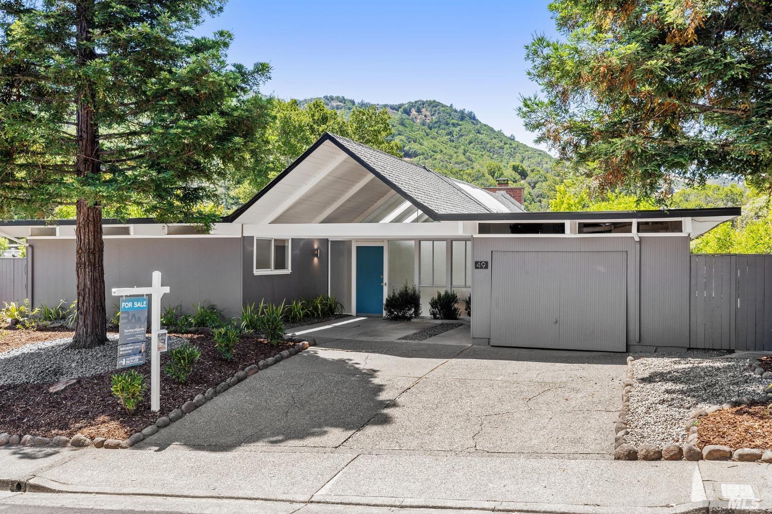 49 Mt Whitney Drive San Rafael, CA 94903 - Photo 1 of 1 a front view of a house with a yard and potted plants