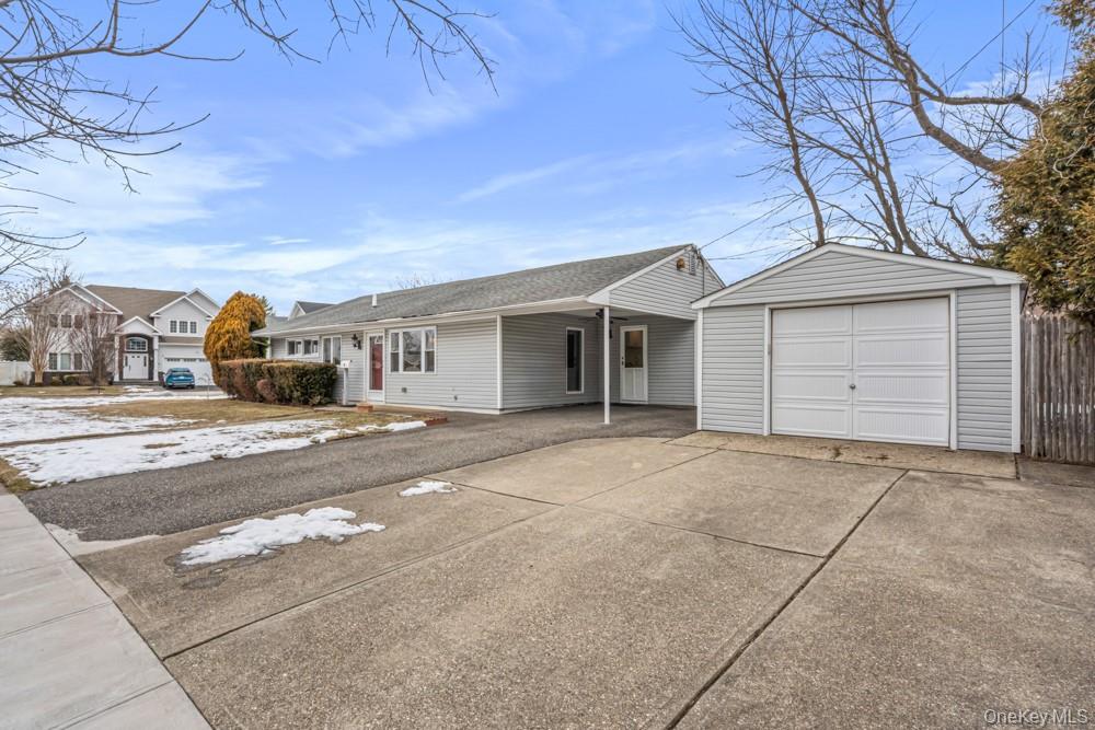 1 Virginia Road Syosset, NY 11791 - Photo 16 of 16 front view of a house with a street
