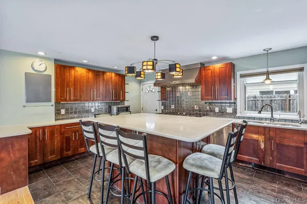 a dining table with chairs and window
