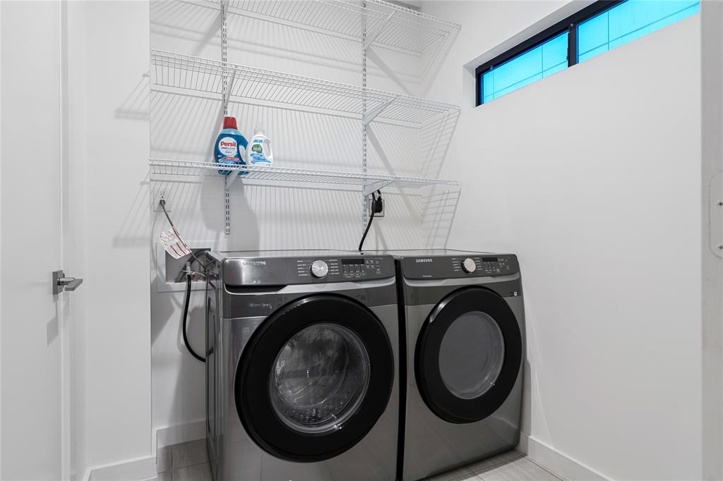 1002 Mobile Street, Unit 1 Dallas, TX 75208 - Photo 20 of 34 Laundry room featuring independent washer and dryer and light tile patterned floors