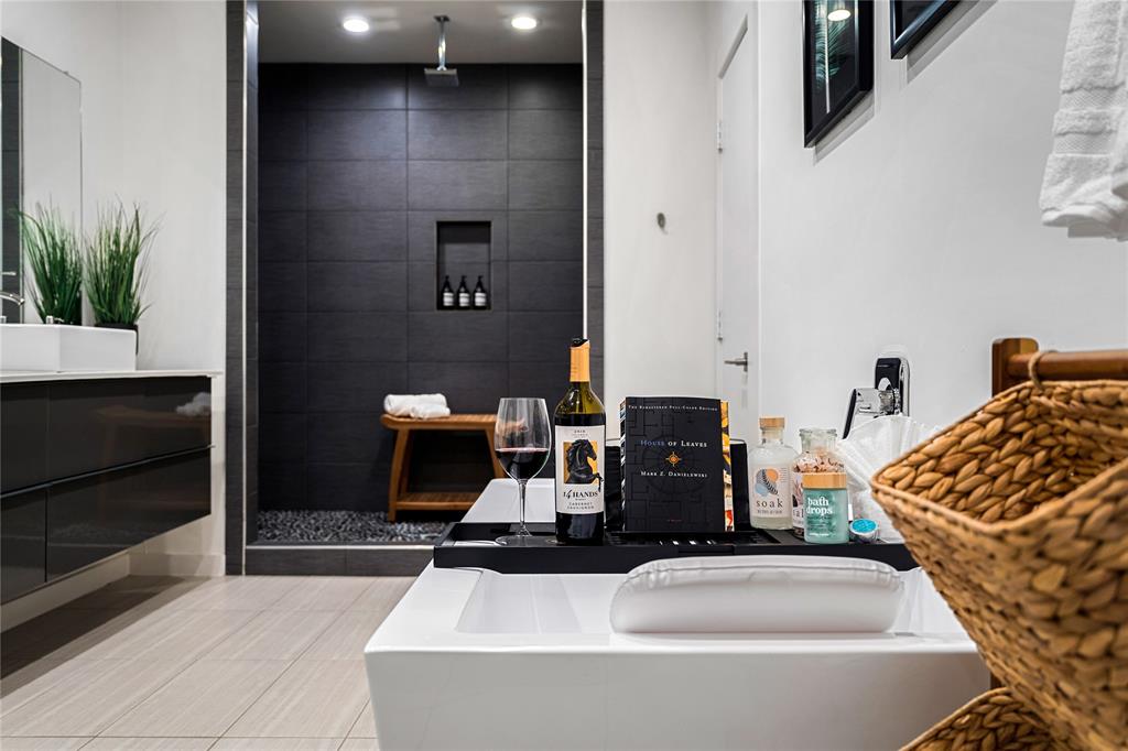 1002 Mobile Street, Unit 1 Dallas, TX 75208 - Photo 30 of 34 Full bath with a bath, vanity, light tile patterned flooring, and a tile shower