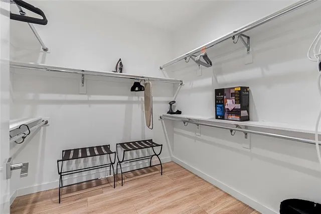 a view of storage and utility room with racks on the wall