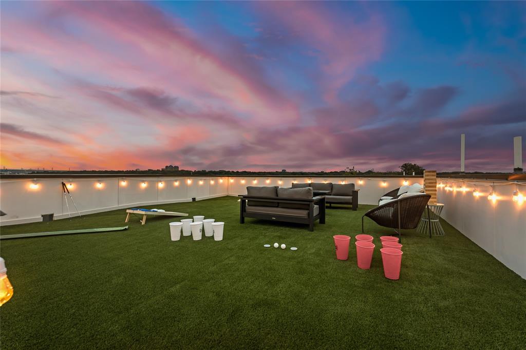 1002 Mobile Street, Unit 1 Dallas, TX 75208 - Photo 33 of 34 View of grassy yard featuring a patio area, an outdoor hangout area, and a water view