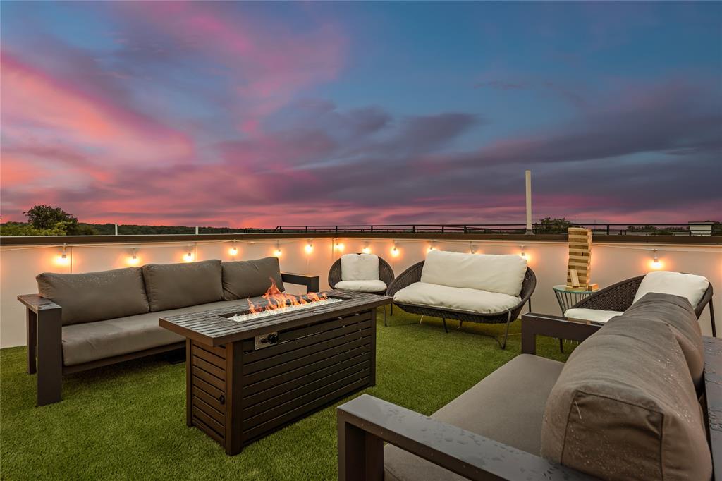 1002 Mobile Street, Unit 1 Dallas, TX 75208 - Photo 34 of 34 View of patio featuring an outdoor living space with a fire pit and a water view