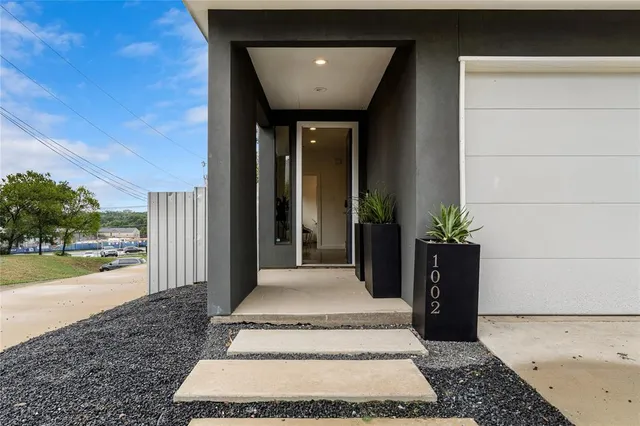 a spacious bathroom with a granite countertop tub and a garden