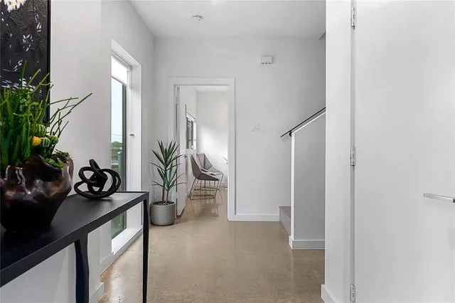 a view of a livingroom with furniture and windows