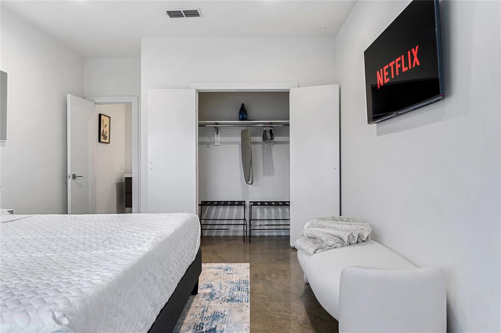 1002 Mobile Street, Unit 1 Dallas, TX 75208 - Photo 8 of 34 Bedroom with concrete flooring and a closet