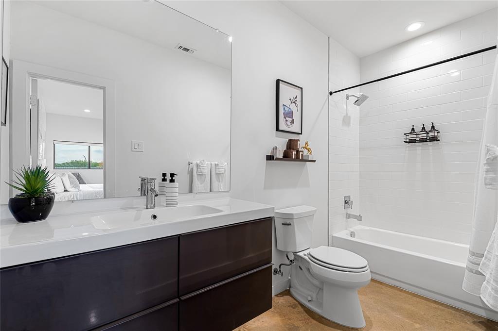 1002 Mobile Street, Unit 1 Dallas, TX 75208 - Photo 9 of 34 Ensuite bathroom featuring recessed lighting, vanity, and shower / bath combo with shower curtain