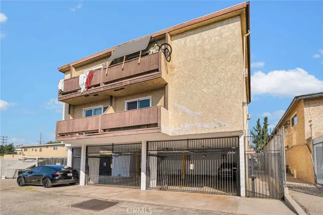 a view of a building with car parked