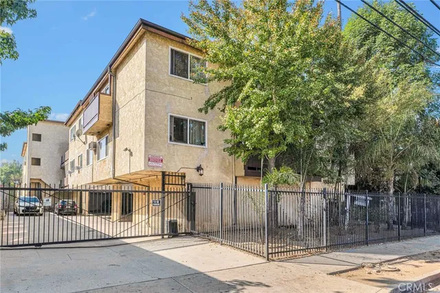 a view of a house with a small yard