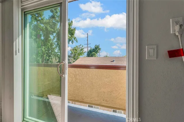 a bathroom with a granite countertop sink toilet mirror and bathtub