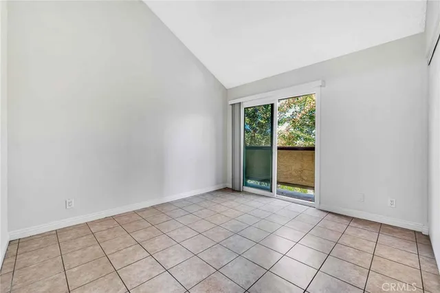 a view of a glass door with a yard from a window