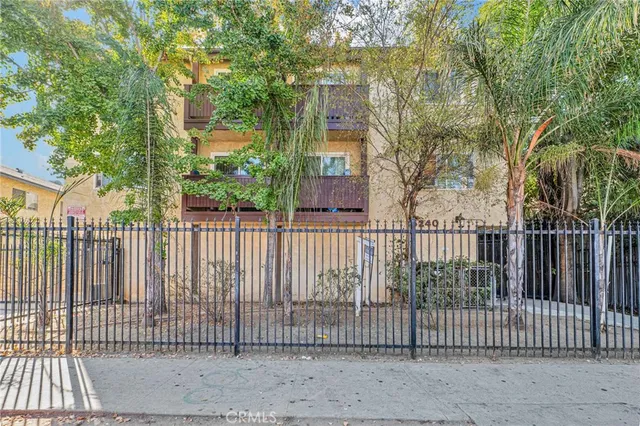 a view of a street with cars