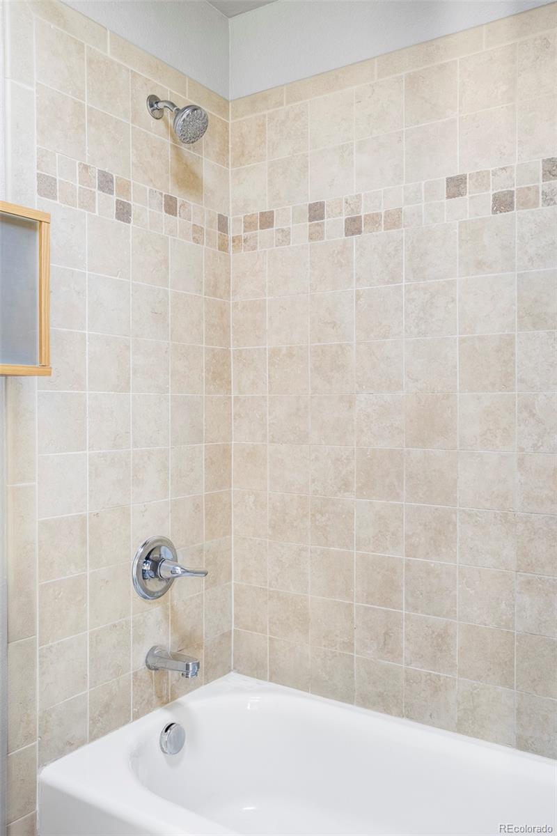 3265 Foundry Place, Unit 101O Boulder, CO 80301 - Photo 21 of 36 a bathroom with a sink and shower