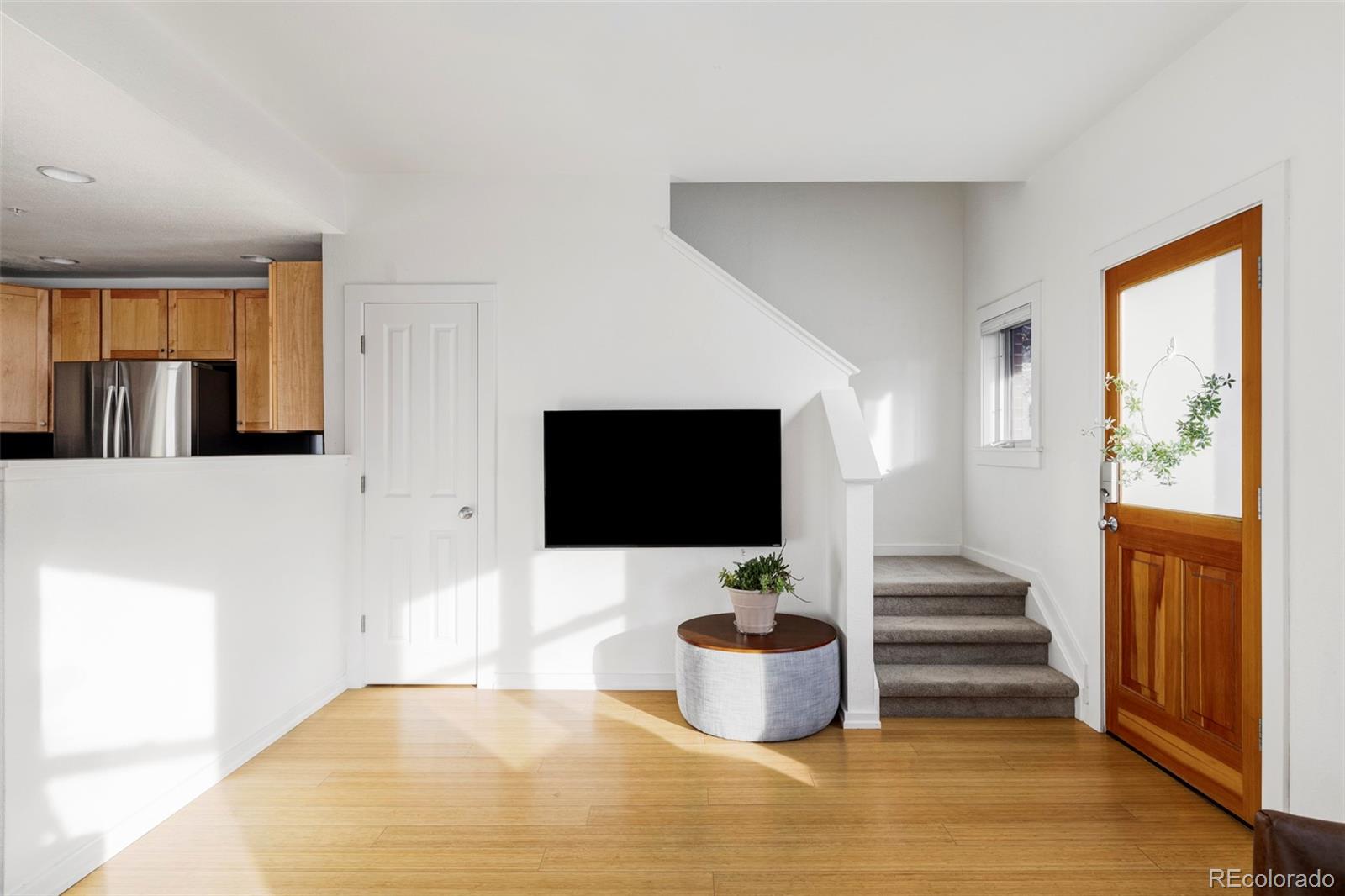 3265 Foundry Place, Unit 101O Boulder, CO 80301 - Photo 6 of 36 a living room with furniture and a flat screen tv
