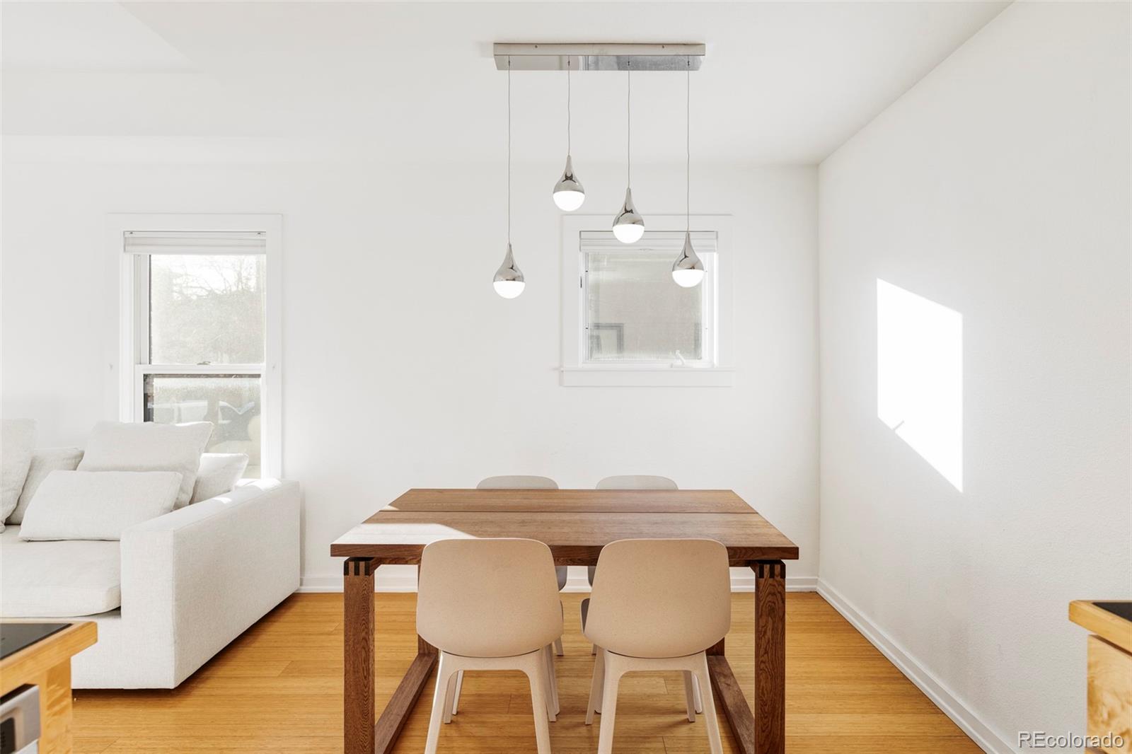 3265 Foundry Place, Unit 101O Boulder, CO 80301 - Photo 9 of 36 a view of a dining room with furniture and wooden floor