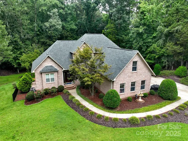 a view of a house with a yard and porch