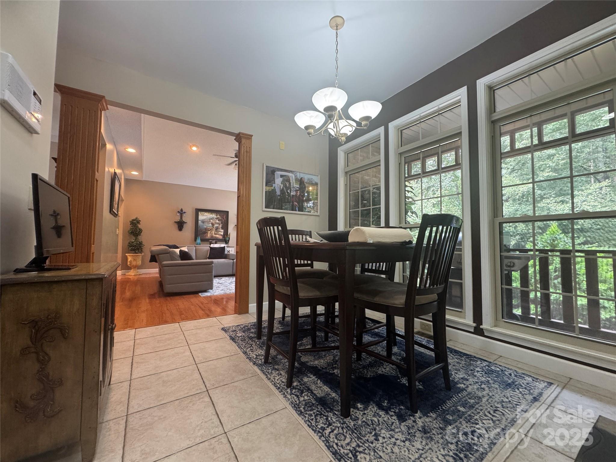 160 Dockside Drive Salisbury, NC 28146 - Photo 17 of 43 a view of a dining room with furniture a chandelier and wooden floor
