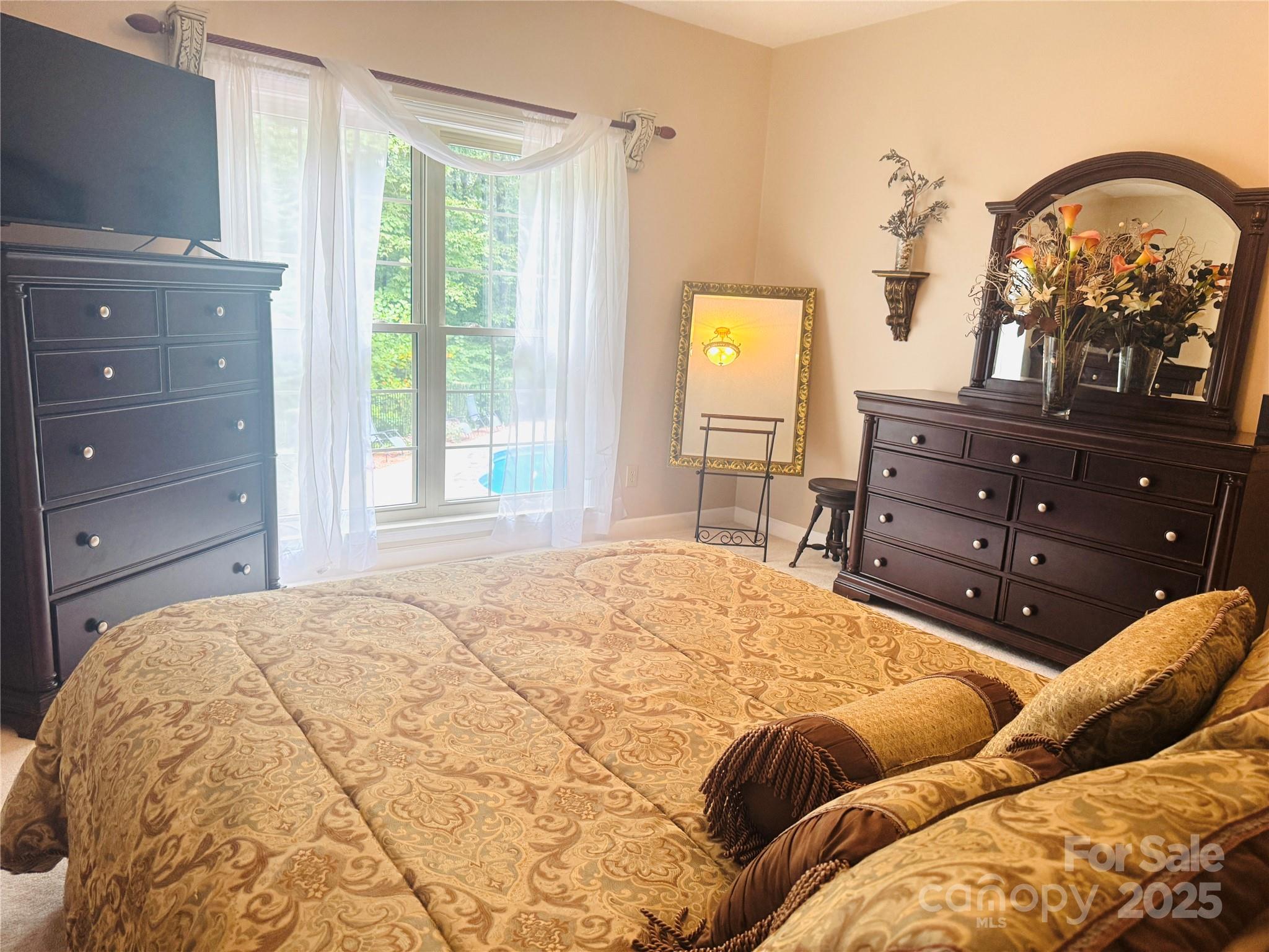 160 Dockside Drive Salisbury, NC 28146 - Photo 23 of 43 a bedroom with a bed and a dresser with mirror