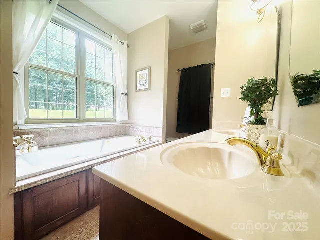a view of a bathroom with a tub