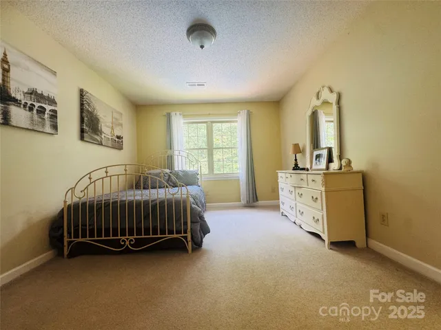 a view of bathroom with sink and mirror