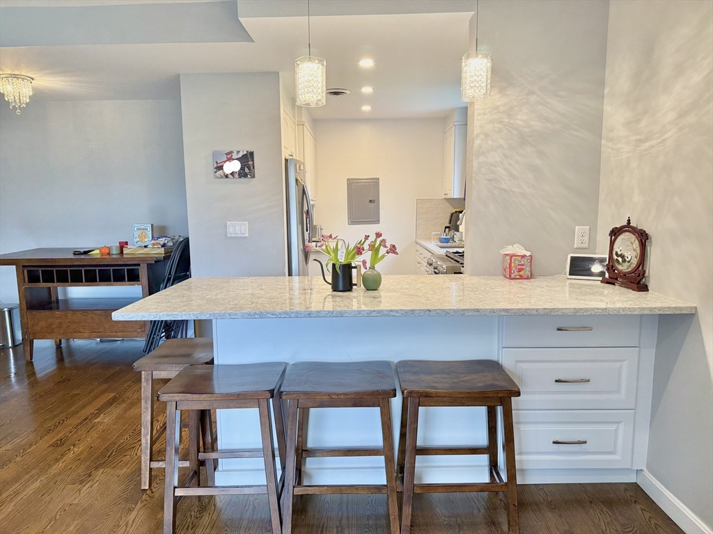 a kitchen with a table and chairs in it