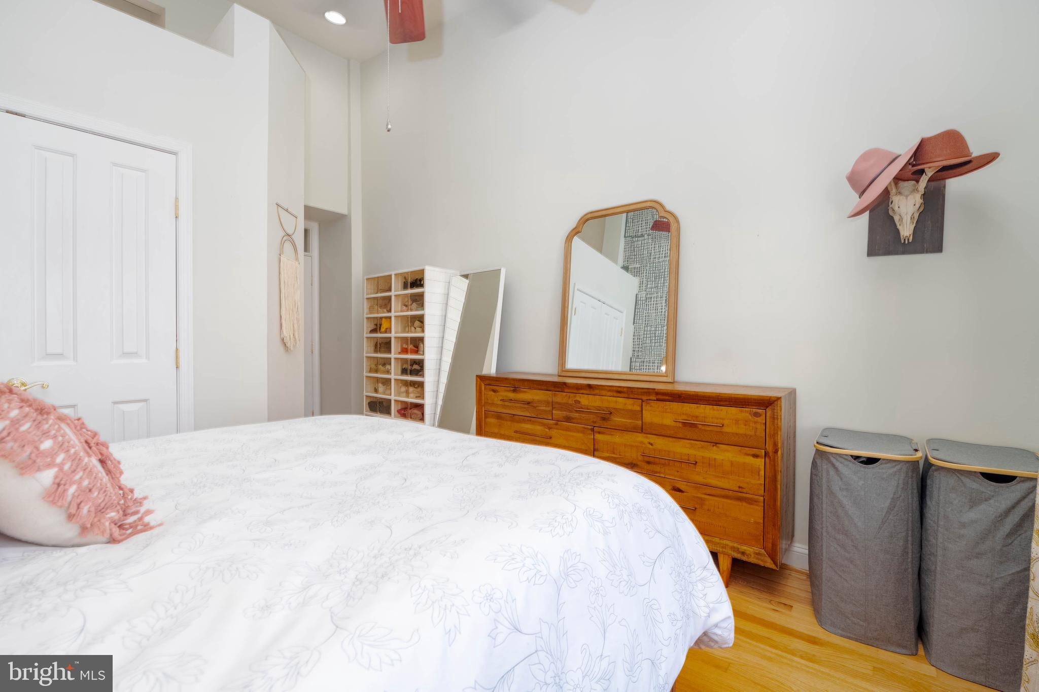 318 South Duncan Street Baltimore, MD 21231 - Photo 15 of 27 a bedroom with a bed and wooden floor