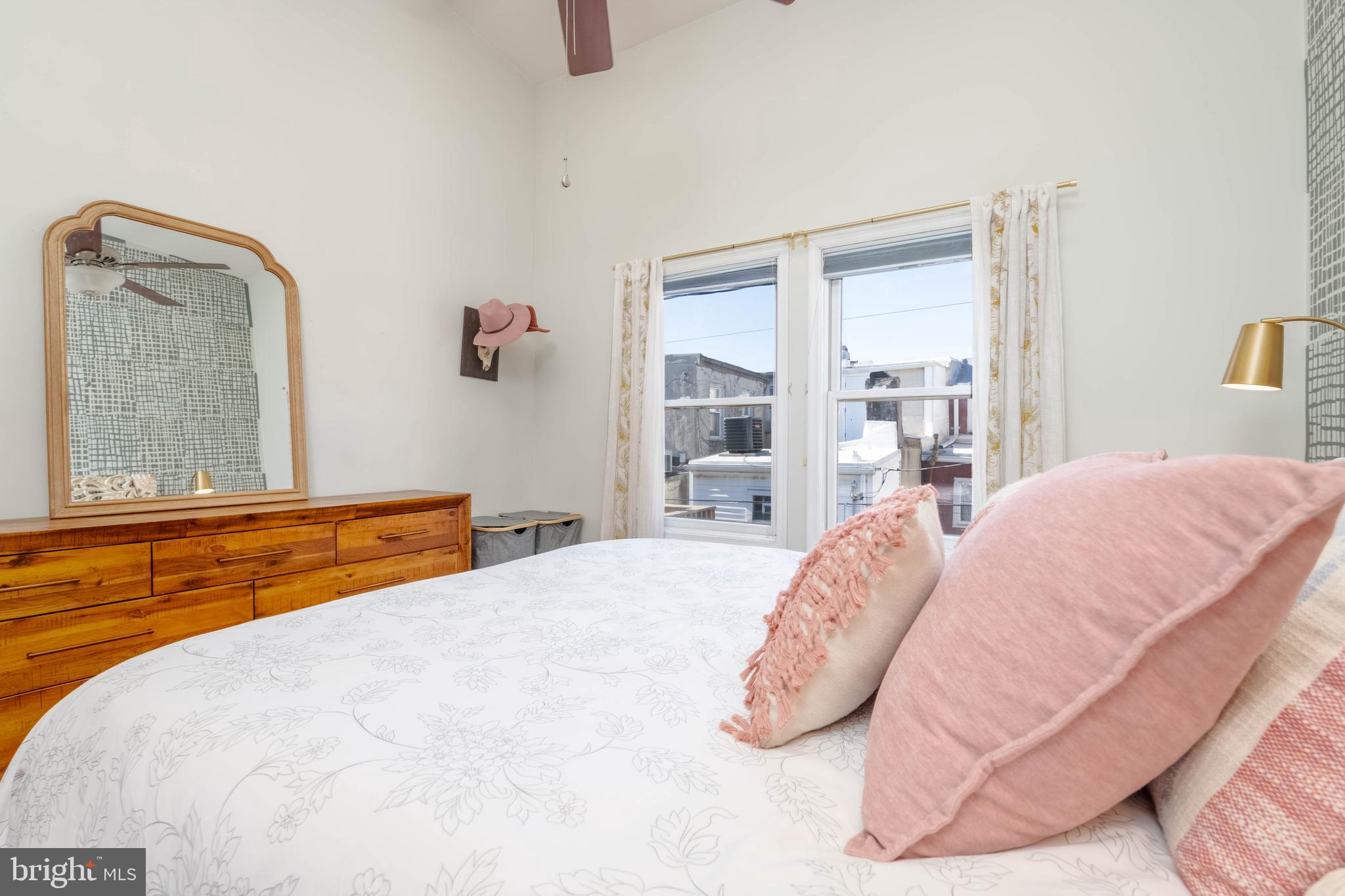 318 South Duncan Street Baltimore, MD 21231 - Photo 16 of 27 a bedroom with a bed and window