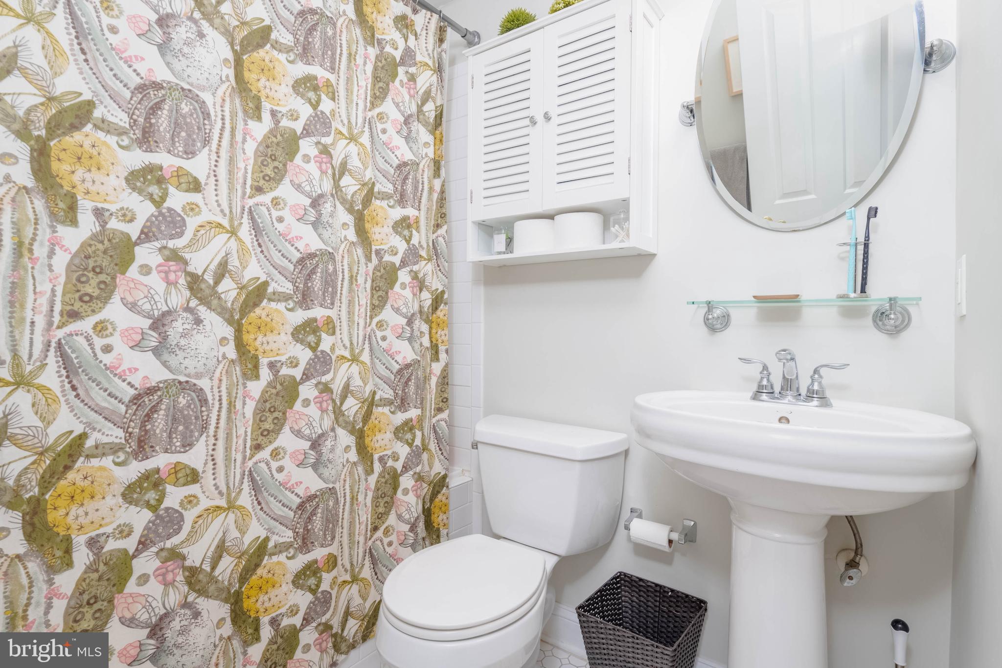 318 South Duncan Street Baltimore, MD 21231 - Photo 17 of 27 a bathroom with a sink a toilet and a mirror