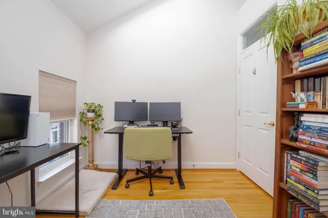 a workspace with furniture and bookshelf