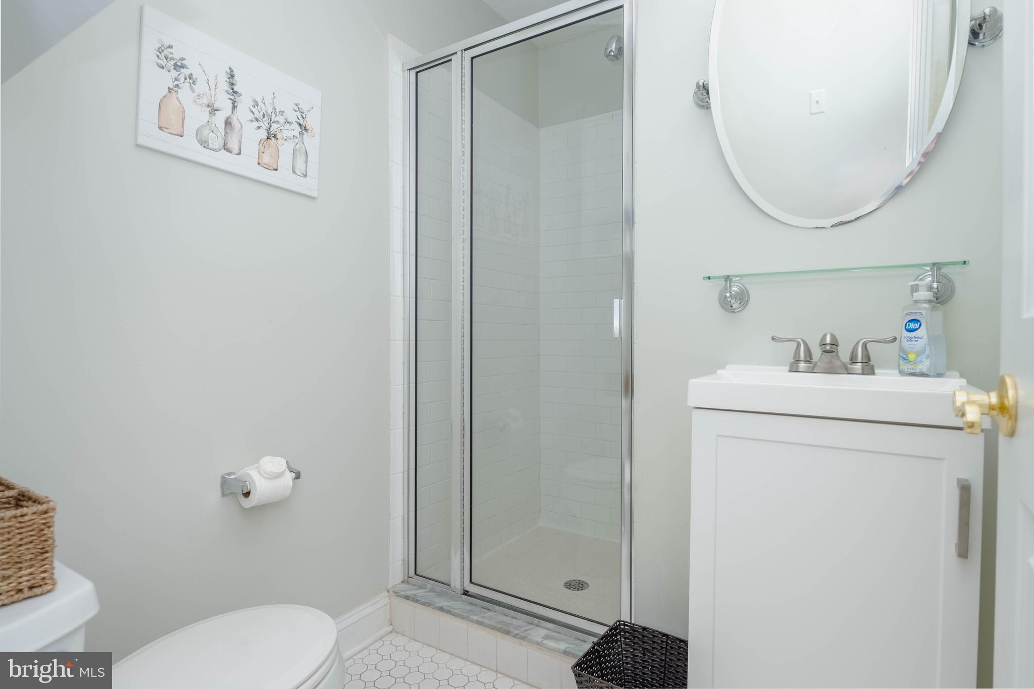 318 South Duncan Street Baltimore, MD 21231 - Photo 22 of 27 a bathroom with a sink a toilet and a mirror