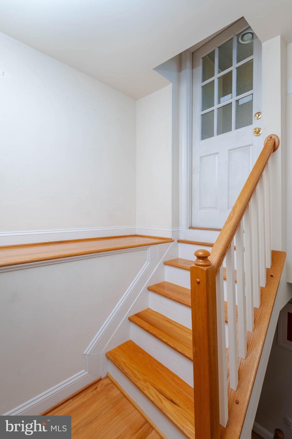318 South Duncan Street Baltimore, MD 21231 - Photo 23 of 27 a view of entryway with wooden floor and stairs