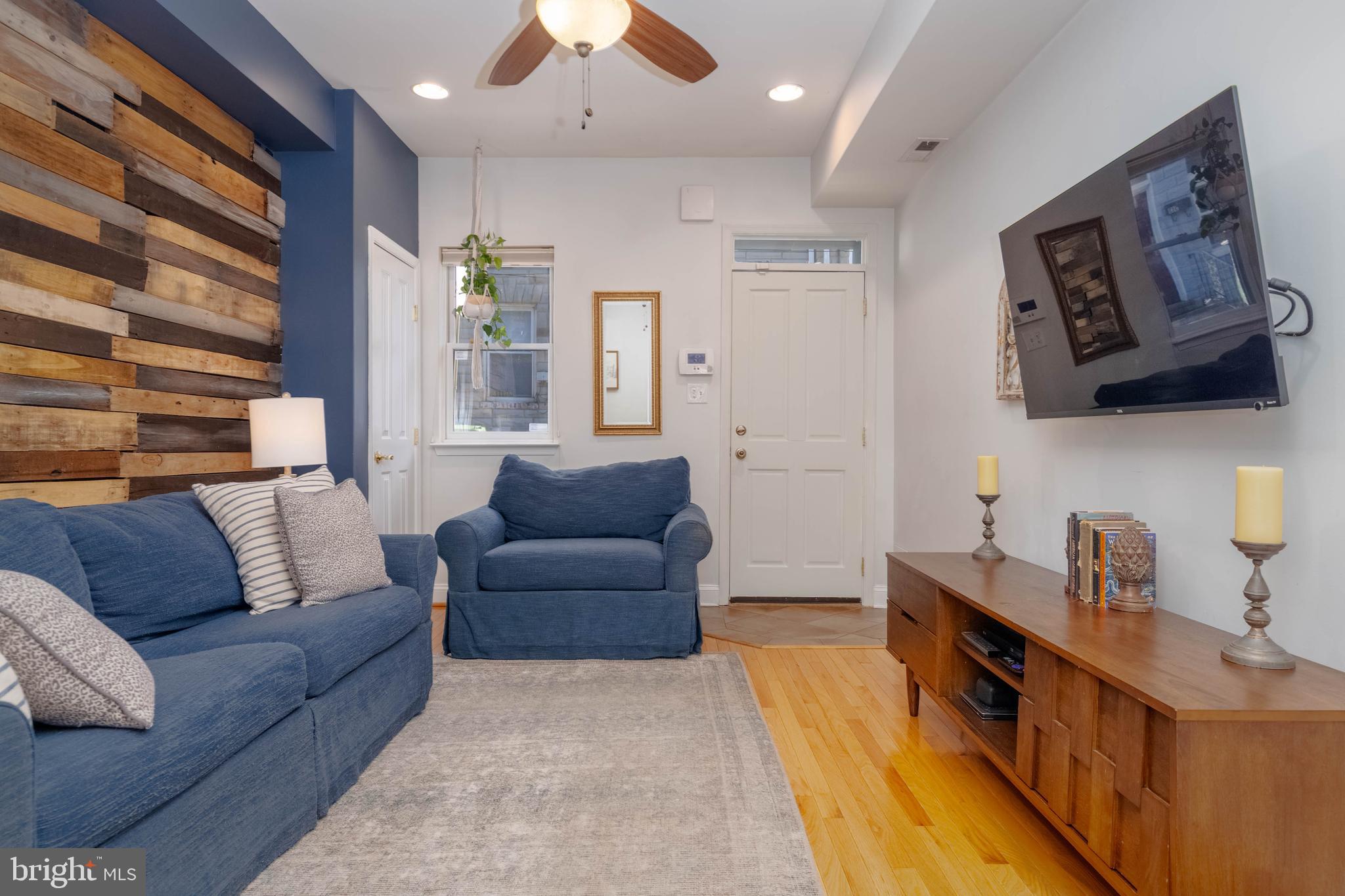 318 South Duncan Street Baltimore, MD 21231 - Photo 3 of 27 a living room with furniture and a flat screen tv