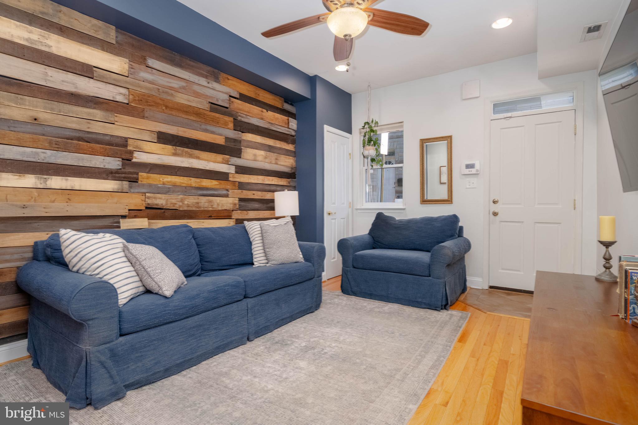 318 South Duncan Street Baltimore, MD 21231 - Photo 4 of 27 a living room with furniture and a large window