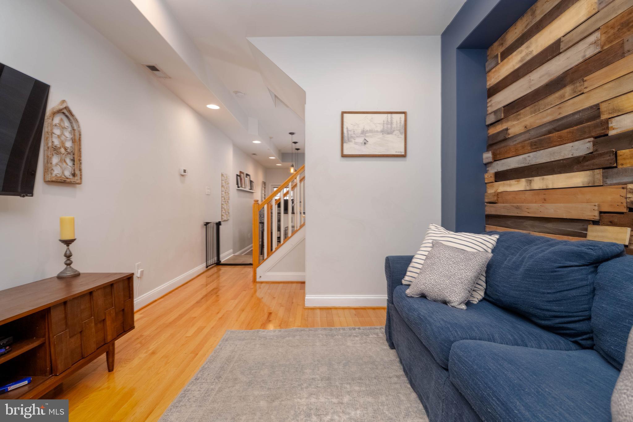 318 South Duncan Street Baltimore, MD 21231 - Photo 6 of 27 a living room with furniture and a flat screen tv