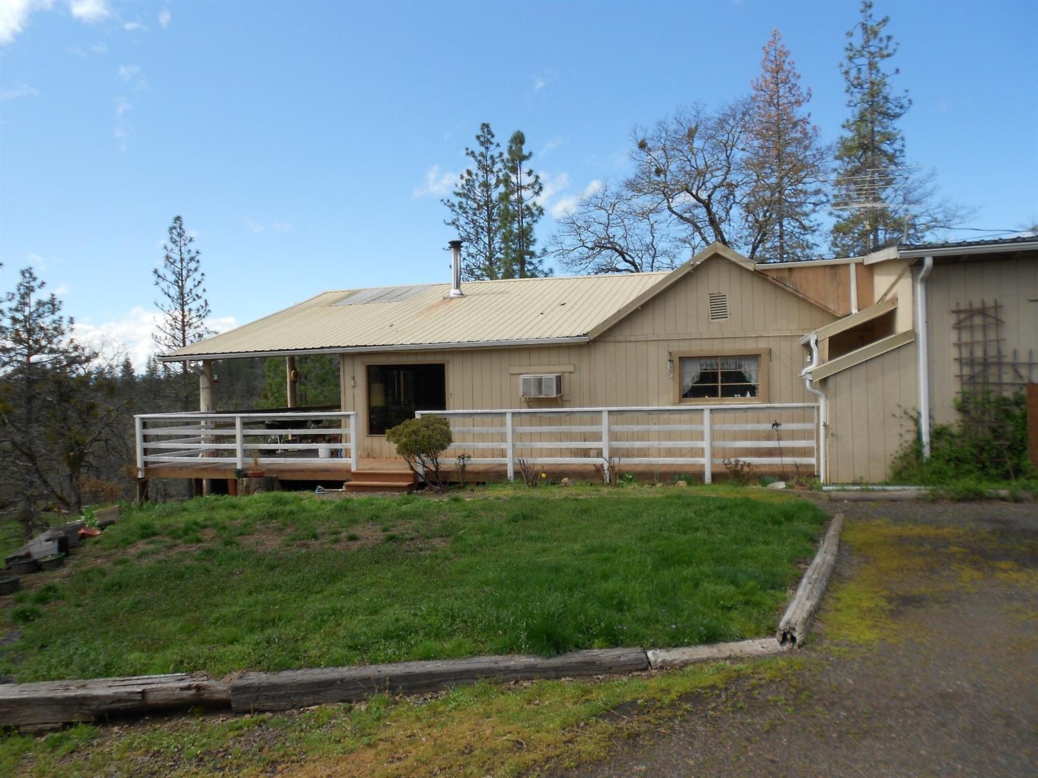 1888 South Obenchain Road Eagle Point, OR 97524 - Photo 23 of 34 a front view of a house with a garden