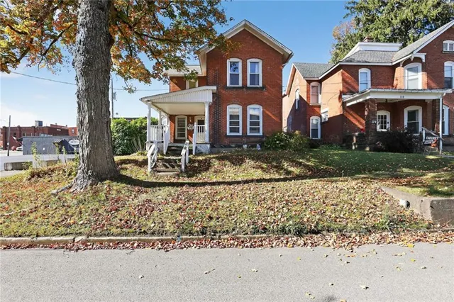a front view of a house with a yard