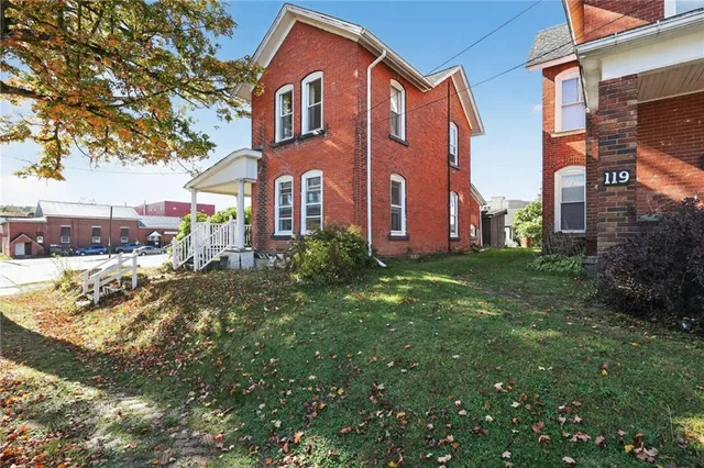 a front view of a house with a yard