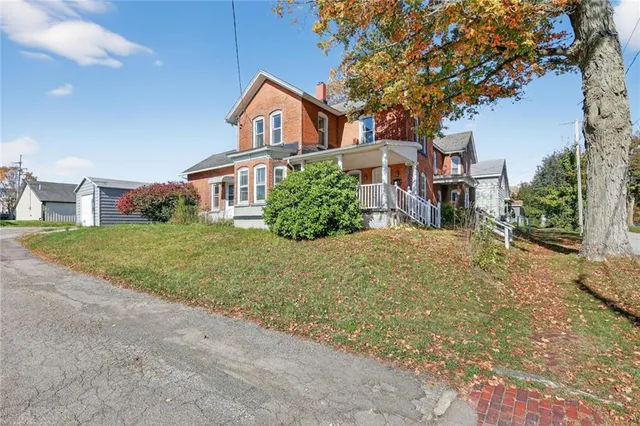 a front view of a house with a yard