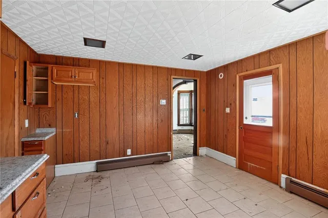 a view of a livingroom with an empty space and a window