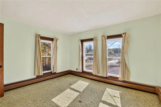 a kitchen with a refrigerator and a sink