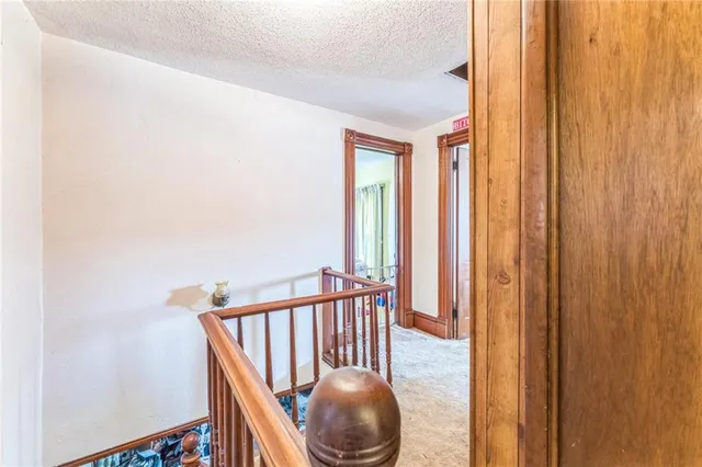 a view of a balcony with furniture and floor to ceiling window