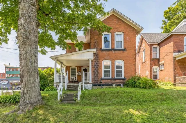 front view of a house with a yard