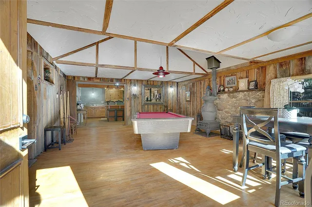 a bathroom with a granite countertop sink mirror vanity and toilet