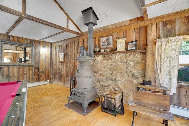 a kitchen with stainless steel appliances granite countertop a stove and a wooden cabinets