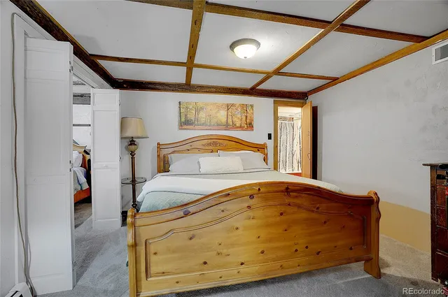 a bathroom with a shower a toilet and a sink