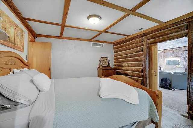 a view of a garden with a bench under an umbrella