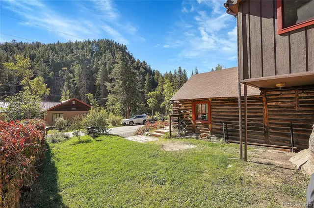 a house view with a backyard space