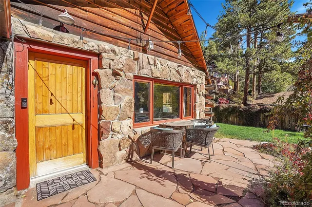 a view of yard with patio